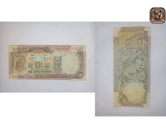 ten rupees note with peacock on tree theme